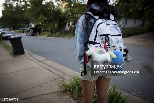 Sky Bloomer waits on a friend to give her a ride to Montgomery Blair High School from her home in Silver Spring, Md., on September 25, 2019. For...