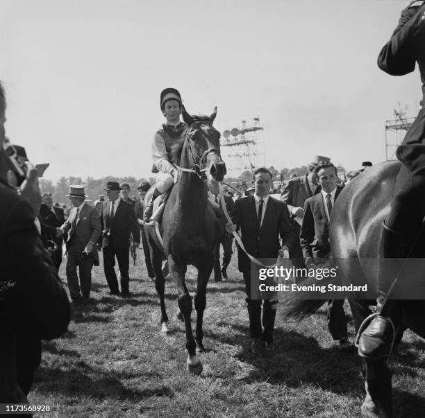 Irish-trained Thoroughbred racehorse and sire Nijinsky with his jockey Lester Piggott after winning the Epsom Derby, UK, 3rd June 1970.