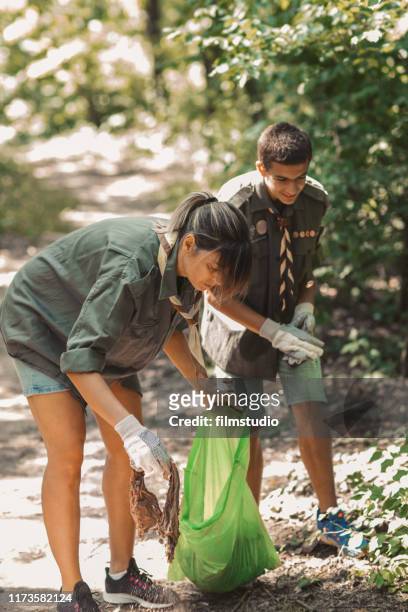 scouts cleaning local forest - boy scout camping stock pictures, royalty-free photos & images