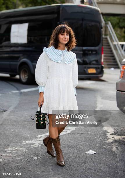 Alyssa Cosacrelli is seen wearing white dress, brown cowboy boots outside Anna Sui during New York Fashion Week September 2019 on September 09, 2019...