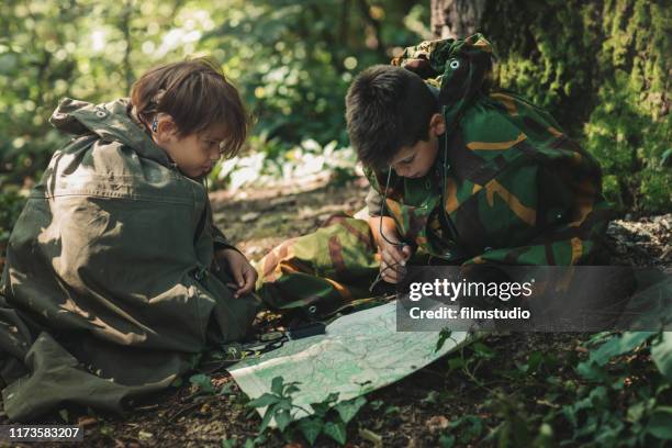 two scouts looking at the map - boy scout stock pictures, royalty-free photos & images