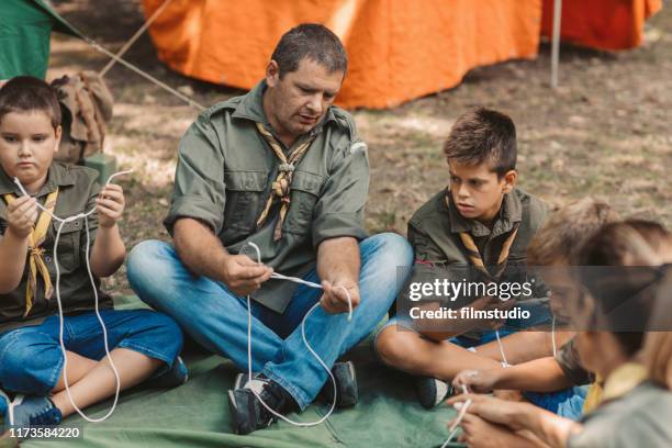 scouts learn to tie the knot - boy scout camping stock pictures, royalty-free photos & images