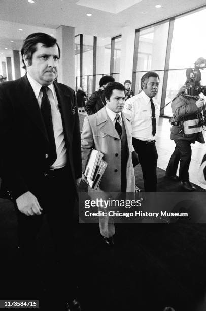 Legal teams walk to the courtroom for John Wayne Gacy's arraignment at the Criminal Courts Building, 2650 South California Avenue, Chicago, Illinois,...