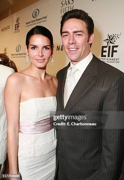 Angie Harmon and Jason Sehorn during Saks Fifth Avenue's Unforgettable Evening Benefitting EIF's Women's Cancer Research Fund - Red Carpet at Regent...