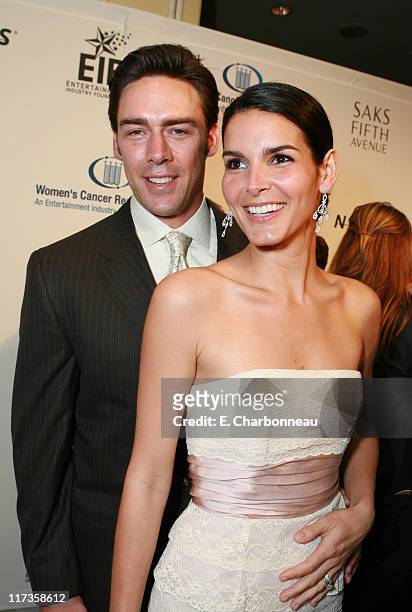 Jason Sehorn and Angie Harmon during Saks Fifth Avenue's Unforgettable Evening Benefitting EIF's Women's Cancer Research Fund - Red Carpet at Regent...