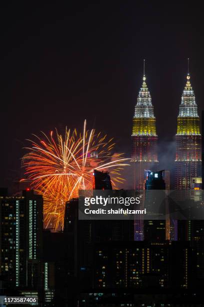 the kuala lumpur skyline glittered with a kaleidoscope of colours and spectacular lights and sound to mark the nation’s 62 years of independence of malaysia. - malaysia skyline stock pictures, royalty-free photos & images