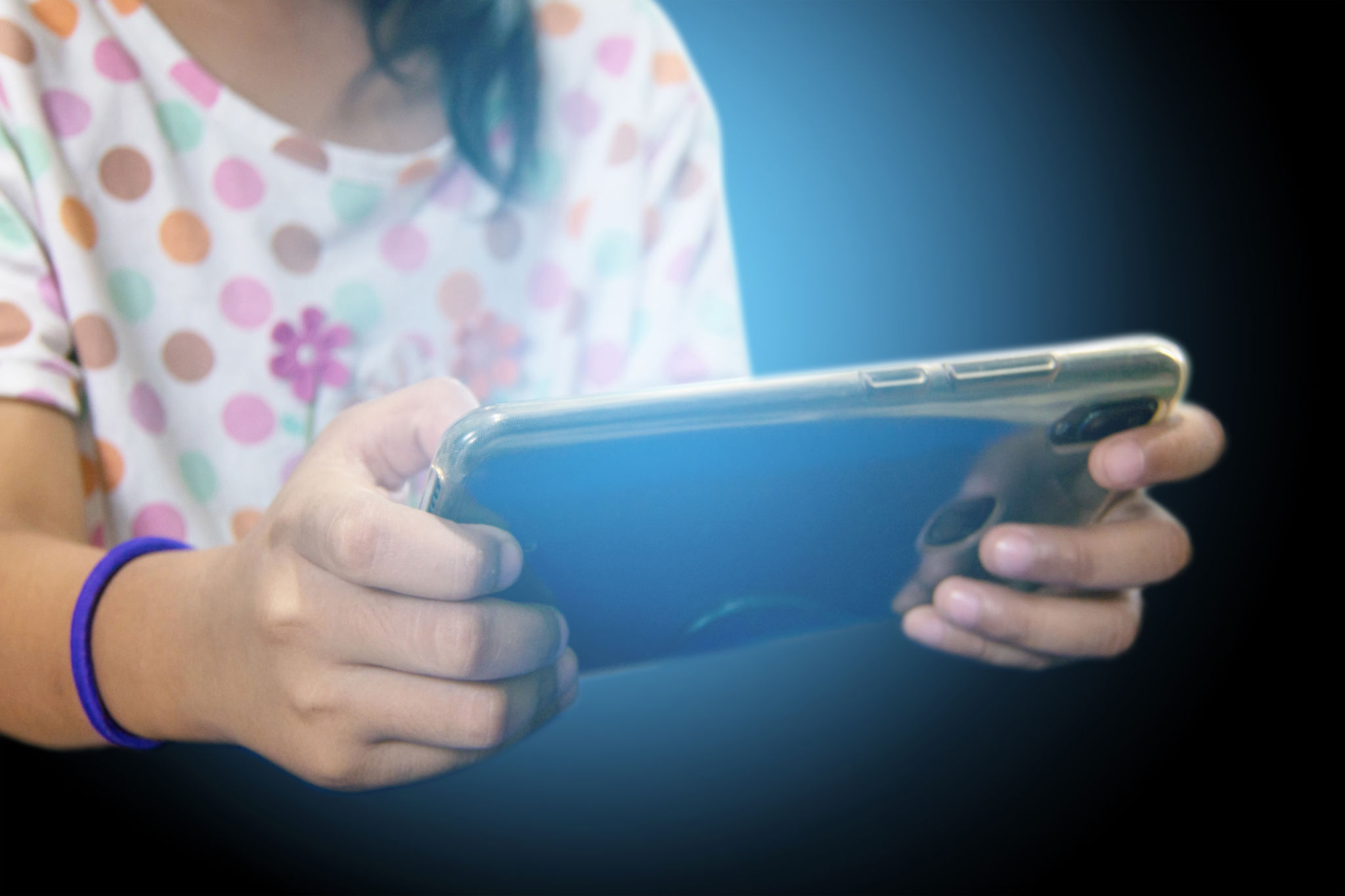 teen girl play smart phone, Blue light from mobile. teen girl play smart phone, Blue light from mobile.