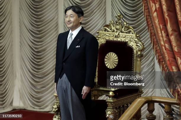 Japan's Emperor Naruhito attends the opening of an extraordinary session at the upper house of the parliament in Tokyo, Japan, on Friday, Oct. 4,...