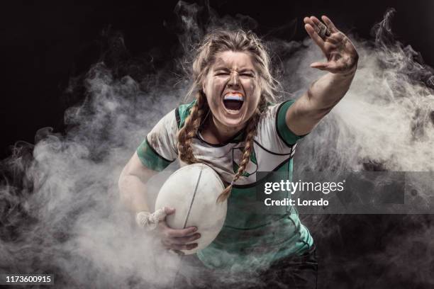a dirty female rugby player - rugby league women stock pictures, royalty-free photos & images