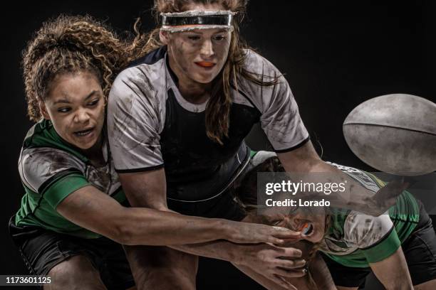 three dirty female rugby players - rugby league women stock pictures, royalty-free photos & images