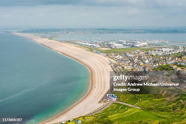 elevated views from portland heights on the isle of portland of chesil beach and the village of fortuneswell, dorset, england, uk, europe - barnet stock pictures, royalty-free photos & images