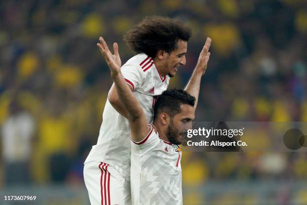 Ali Ahmed Mabkhout of United Arab Emirates celebrates with Omar Abdulrahman after scoring their 2nd goal during the FIFA World Cup Asian Qualifier...