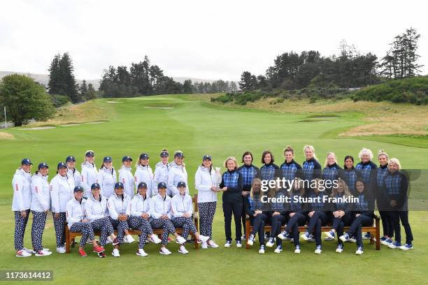 Team USA and Team Europe pose with The Solheim Cup Trophy during the official photo call during Preview Day 2 of The Solheim Cup at Gleneagles on...