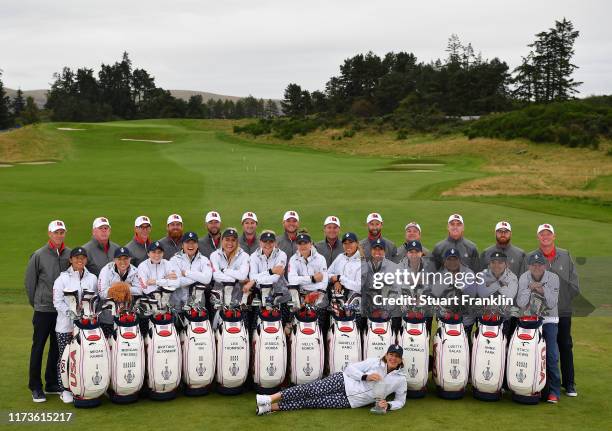 Juli Inkster, Captain of Team USA poses with her team of players and their caddiea for the official team photo during a practice round prior to the...