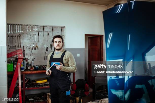 man working on a car - engine failure stock pictures, royalty-free photos & images