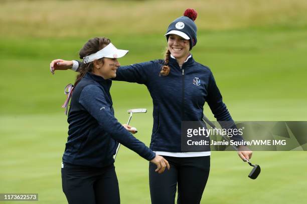 Sadie Englemann and Rachel Heck of Team USA celebrate after winning the hole during the PING Junior Solheim Cup during practice day 2 for The Solheim...