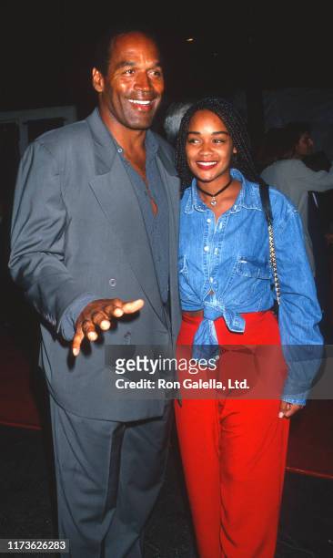 American actor and former football player OJ Simpson and his daughter, Arnelle Simpson, attend a screening of 'Cliffhanger' at Mann Chinese Theater,...