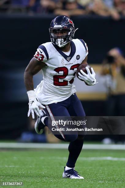 Carlos Hyde of the Houston Texans runs with the ball during a game against the New Orleans Saints at the Mercedes Benz Superdome on September 09,...