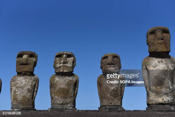 Moais seen at ceremonial platform Ahu Tongariki at Rapa Nui National Park. Moais are monolithic human figures which represented the ancestors. They...