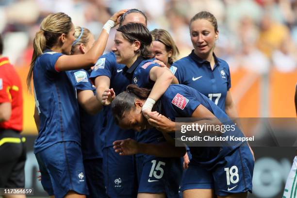 Marie-Laure Delie of France celebrates the first goal with Elise Bussaglia of France during the FIFA Women's World Cup 2011 Group A match between...