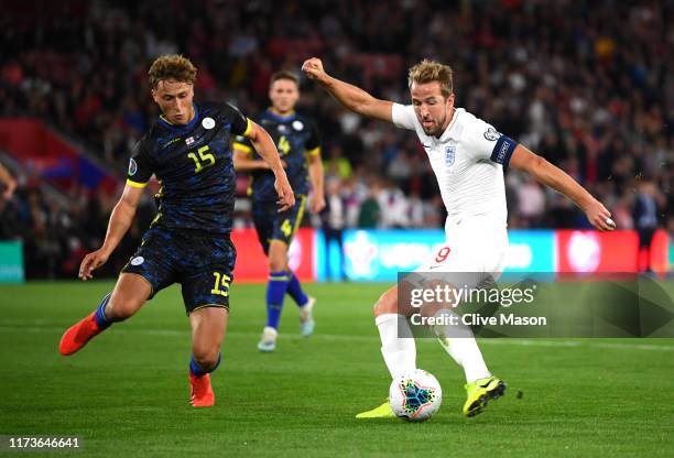 Harry Kane of England scores his sides second goal as he is closed down by Mergim Vojvoda of Bulgaria during the UEFA Euro 2020 qualifier match...