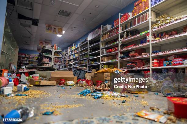 Broken Merchandise are seen scatter on the ground inside a shop in Hong Kong on October 4 Hong Kong invoked emergency powers for the first time in...