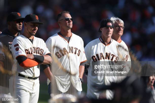 Former San Francisco Giants Ryan Vogelsong , Noah Lowry and Dave Dravecky on field during retirement ceremony for manager Bruce Bochy before game vs...