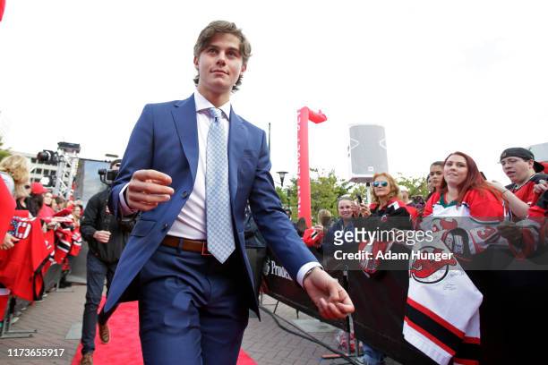 Jack Hughes of the New Jersey Devils arrives prior to a game against the Winnipeg Jets at the Prudential Center on October 4, 2019 in Newark, New...
