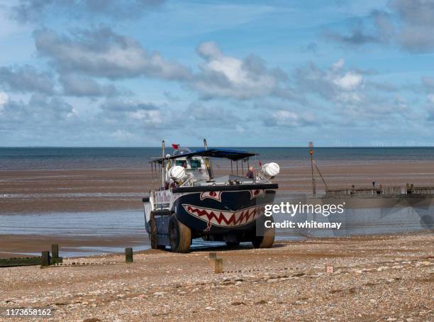 the wash monster reversing on hunstanton beach at low tide - amphibious vehicle stock pictures, royalty-free photos & images