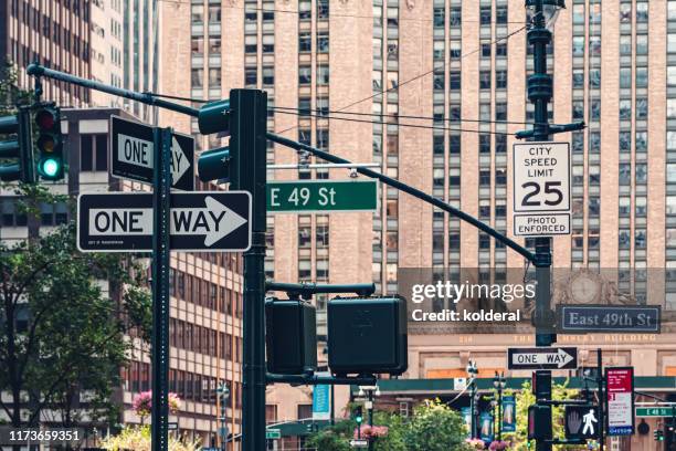 east 49 street in midtown manhattan - speed limit sign stock pictures, royalty-free photos & images