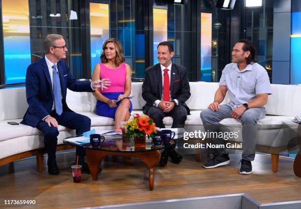 Steve Doocy, Lisa Boothe, Brian Kilmeade and Johnny Damon speak during "FOX & Friends" at Fox News Channel Studios on September 10, 2019 in New York...
