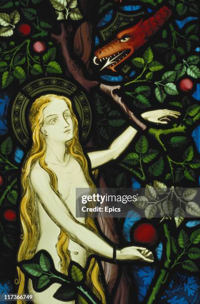 Detail depicting Eve from 'The Temptation of Eve and the Annunciation' stained glass panel by Pugin from Ely Cathedral photo circa 1989.