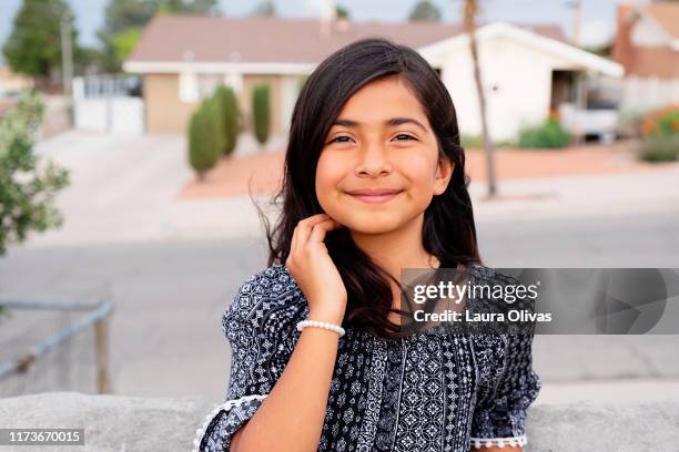 portrait of pre-teen girl in her neighborhood - pre adolescent child stock-fotos und bilder