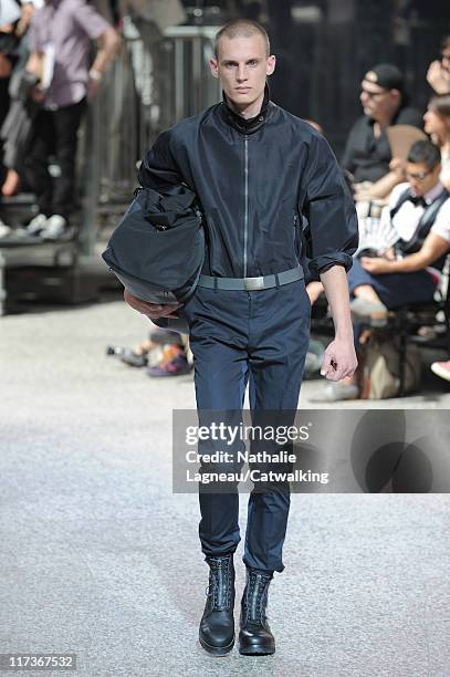 Model walks the runway at the Lanvin menswear fashion show during Paris Fashion Menswear Week on June 26, 2011 in Paris, France.