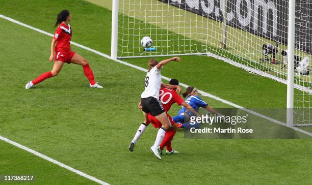 Kerstin Garefrekes of Germany scores her team's opening goal during the FIFA Women's World Cup 2011 Group A match between Germany and Canada at...