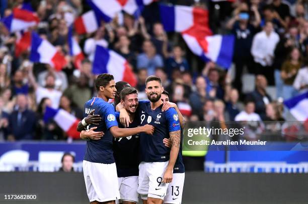 Clement Lenglet of France is congratulated by teammates Raphael Varane and Olivier Giroud after scoring during UEFA Euro 2020 qualifier match between...