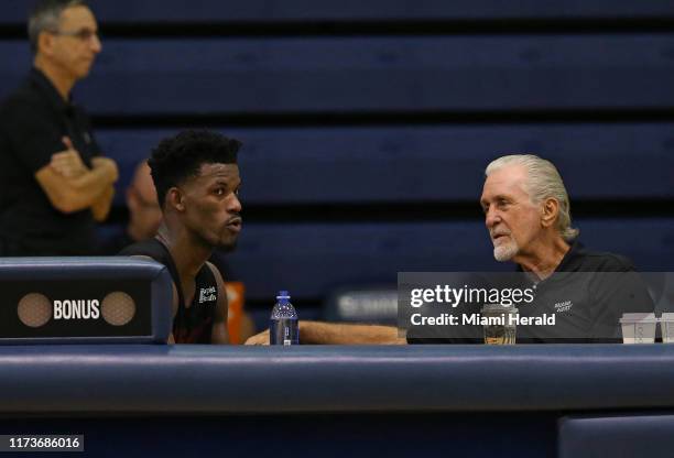 Miami Heat Heat President Pat Riley talks with Heat forward Jimmy Butler during practice on the second day of the Miami Heat training camp in...