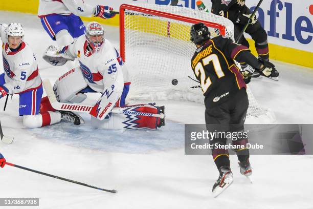 Calvin Thurkauf of the Cleveland Monsters scores his first goal of the season on Charlie Lindgren of the Laval Rocket at Place Bell on October 4,...