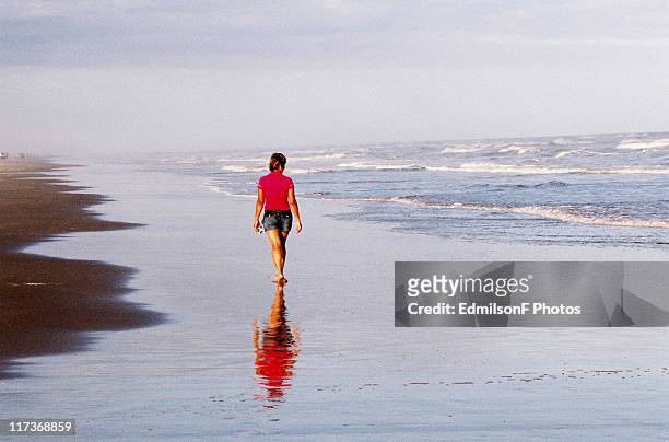 girl walking on beach, balneario gaivota sc - gaivota stock-fotos und bilder