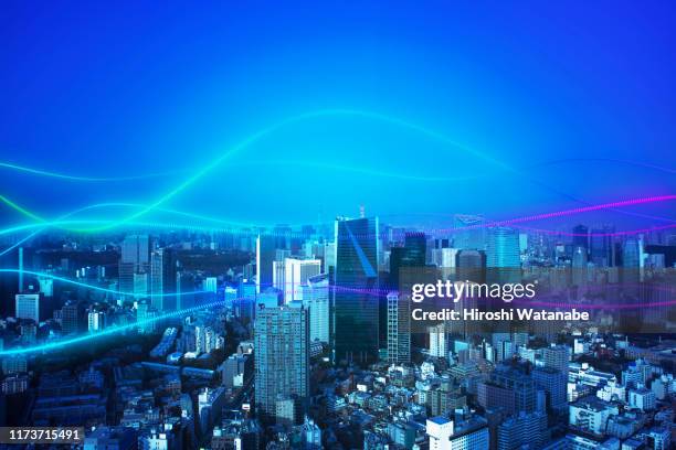 cityscape with abstract light trail - 5g wireless technology stock pictures, royalty-free photos & images