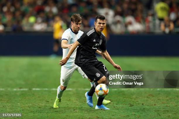 Hirving Lozano of Mexico and Nicolas Tagliafico of Argentina fight for the ball during the international friendly match between Argentina and Mexico...