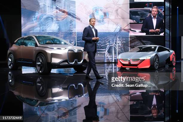 Oliver Zipse, head of BMW, speaks while standing next to the BMW iNEXT and M NEXT concept cars during the press days at the 2019 IAA Frankfurt Auto...