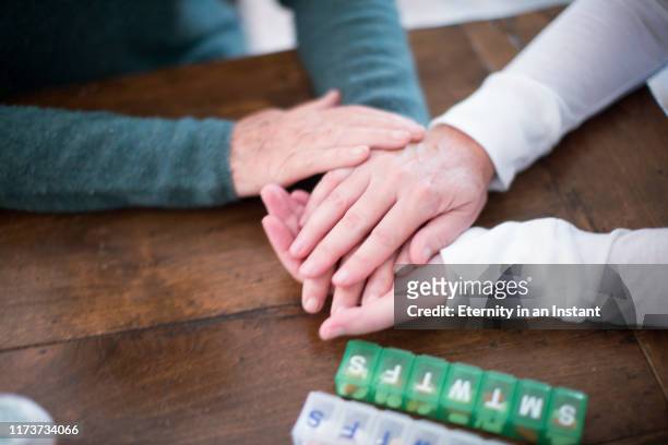 cu caregiver holding senior women's hands - emotional support stock pictures, royalty-free photos & images
