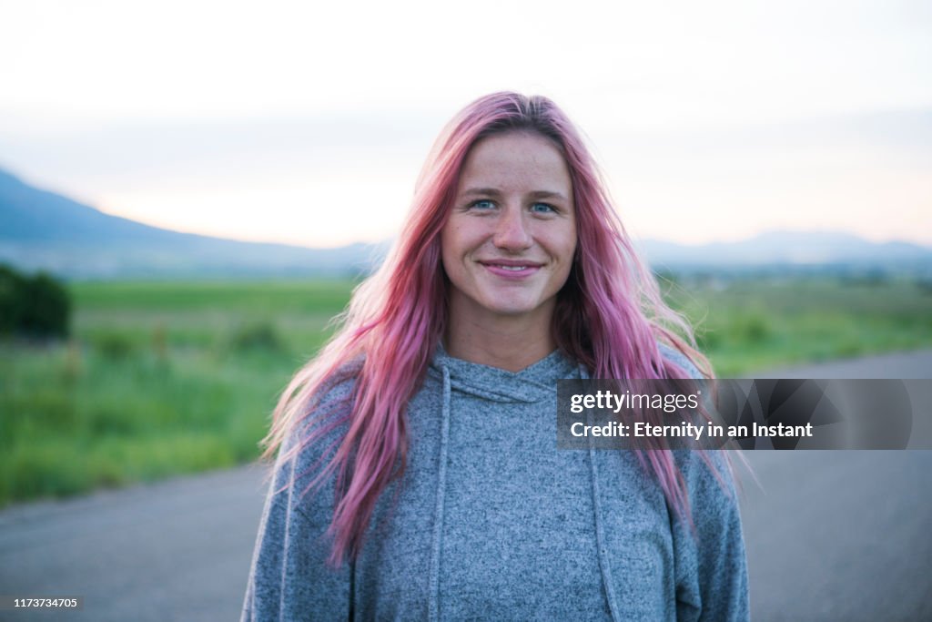 Portrait of teenage girl with pink hair