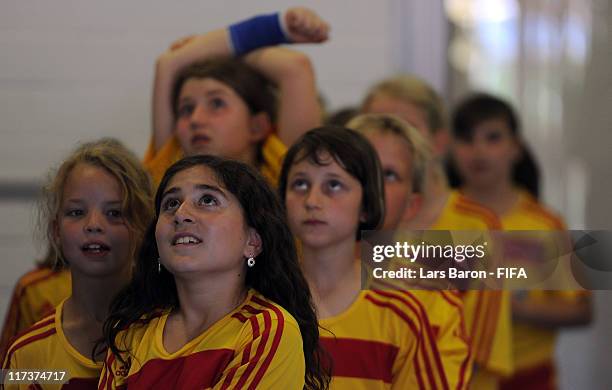 The players escort kids are seen prior to the FIFA Women's World Cup 2011 Group A match between Nigeria and France at Rhein-Neckar-Arena on June 26,...