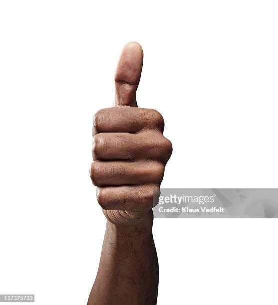 close-up of male hand doing "thumbs up" sign - thumbs up stock-fotos und bilder