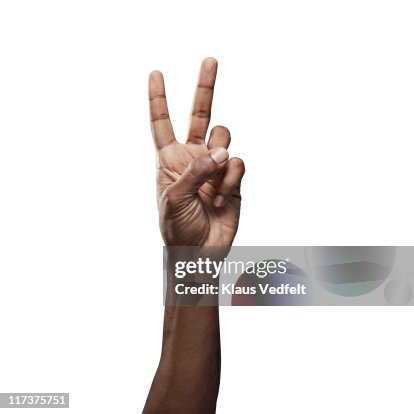 Close-up of male hand doing "peace" sign Close-up of male hand doing "peace" sign
