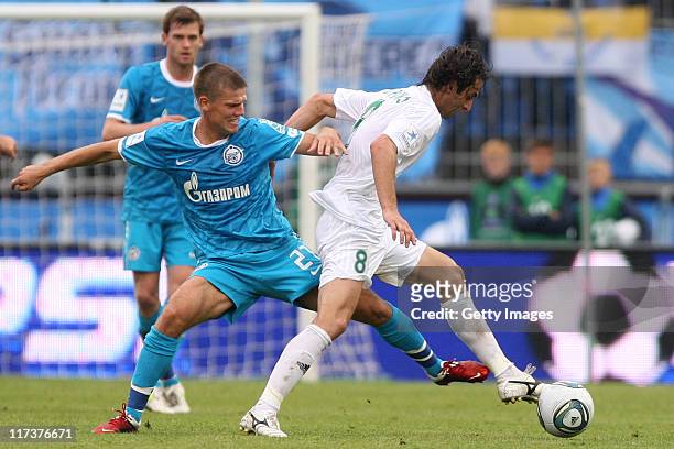 Igor Denisov of FC Zenit St. Petersburg battles for the ball with Mauricio of FC Terek Grozny during the Russian Football League Championship match...