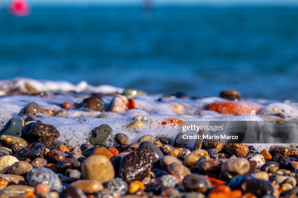 Light Beach Rocks Colored Rocks On The Beach High-Res Stock Photo - Getty Images