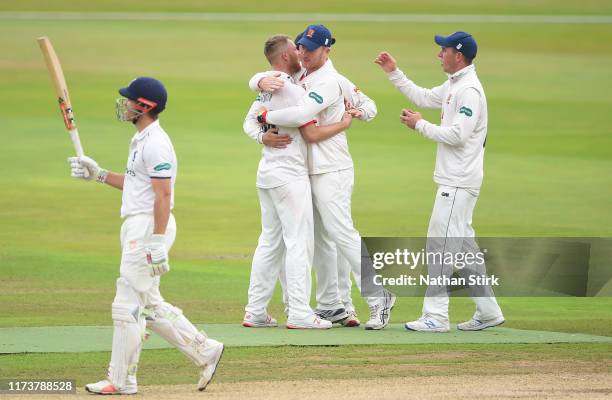 Jamie Porter of Essex celebrates as he gets Sam Hain of Warwickshire out during the County Championship Division One match between Warwickshire and...